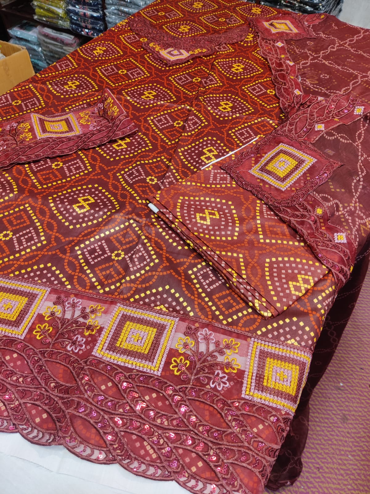 Colorful Chunri Mherron fabric by Danish Cloth, showcasing intricate traditional patterns and vibrant textile design.