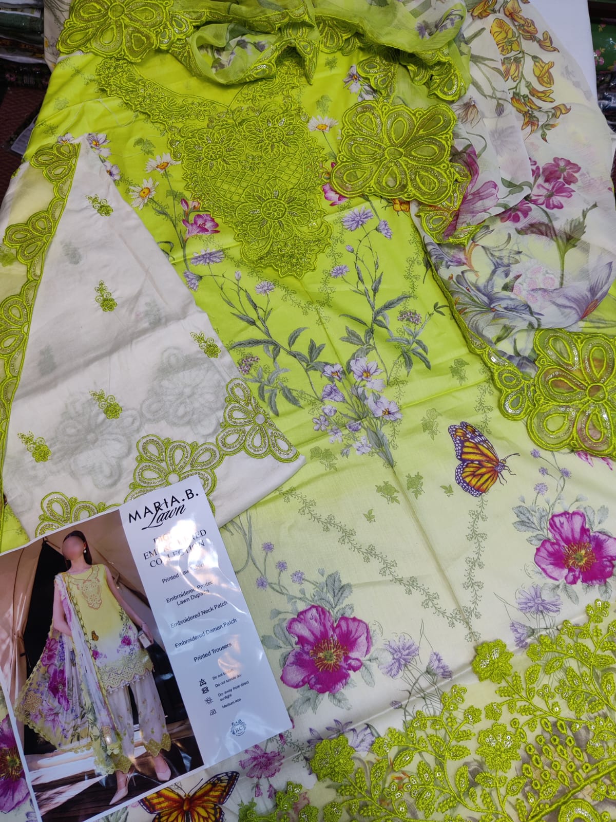 Lawn green fabric by Danish Cloth from Maria.B, showcasing a close-up of soft, vibrant green textile material.