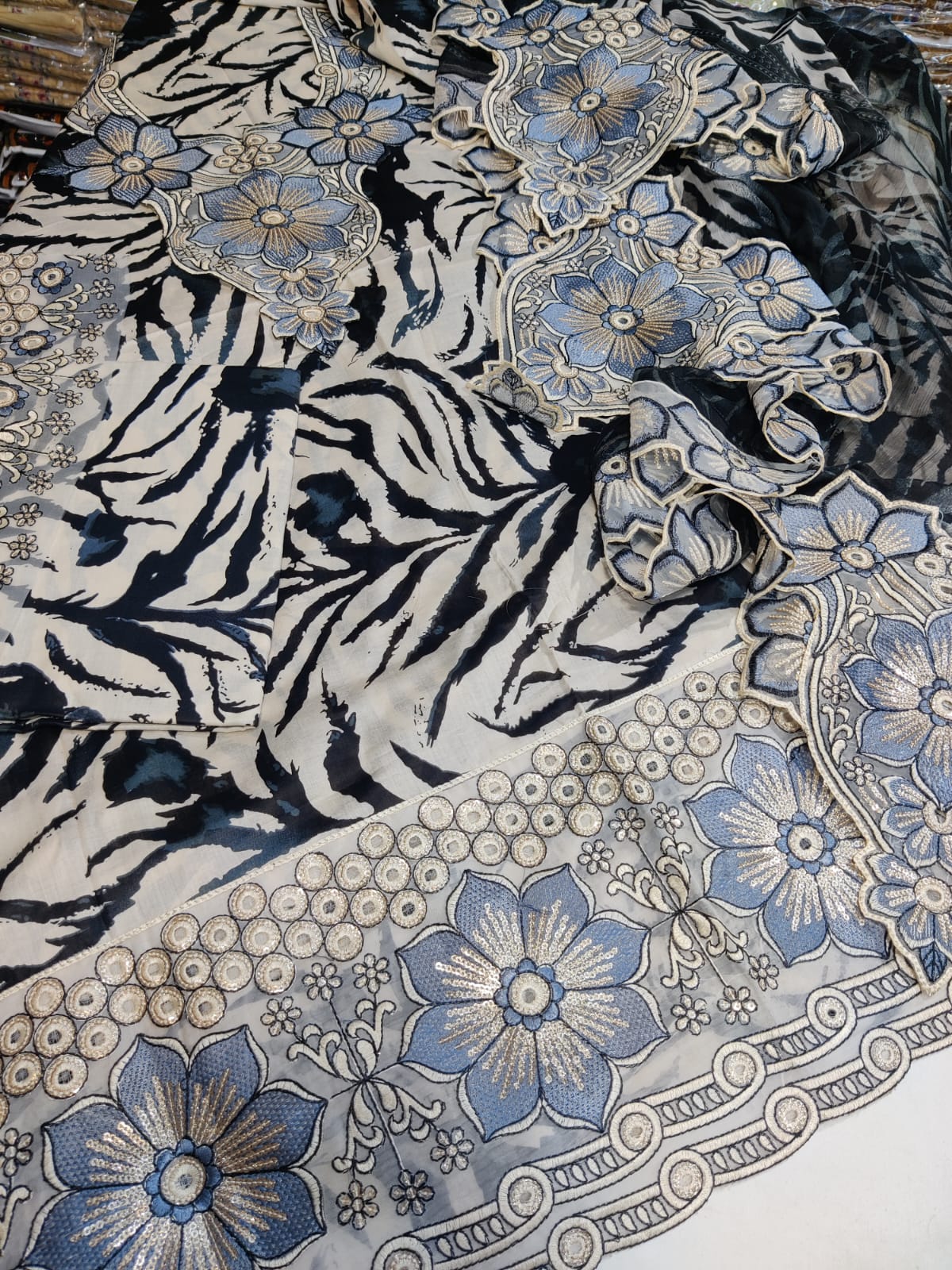 Gray Baroque Dman tiger pattern fabric by Danish Cloth, showcasing intricate tiger and baroque design on soft textile.