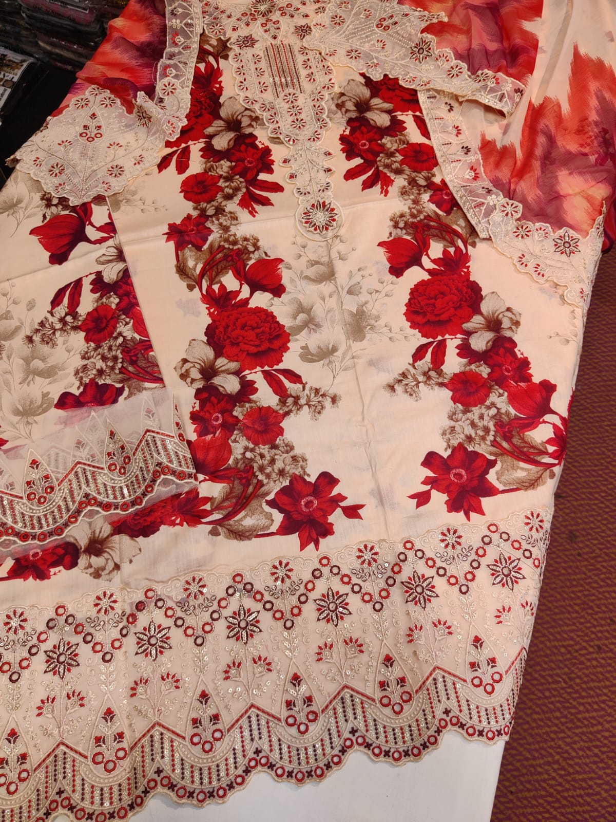 Danish Cloth Agha 3D Gulab fabric with intricate floral design in vibrant pink and green colors.