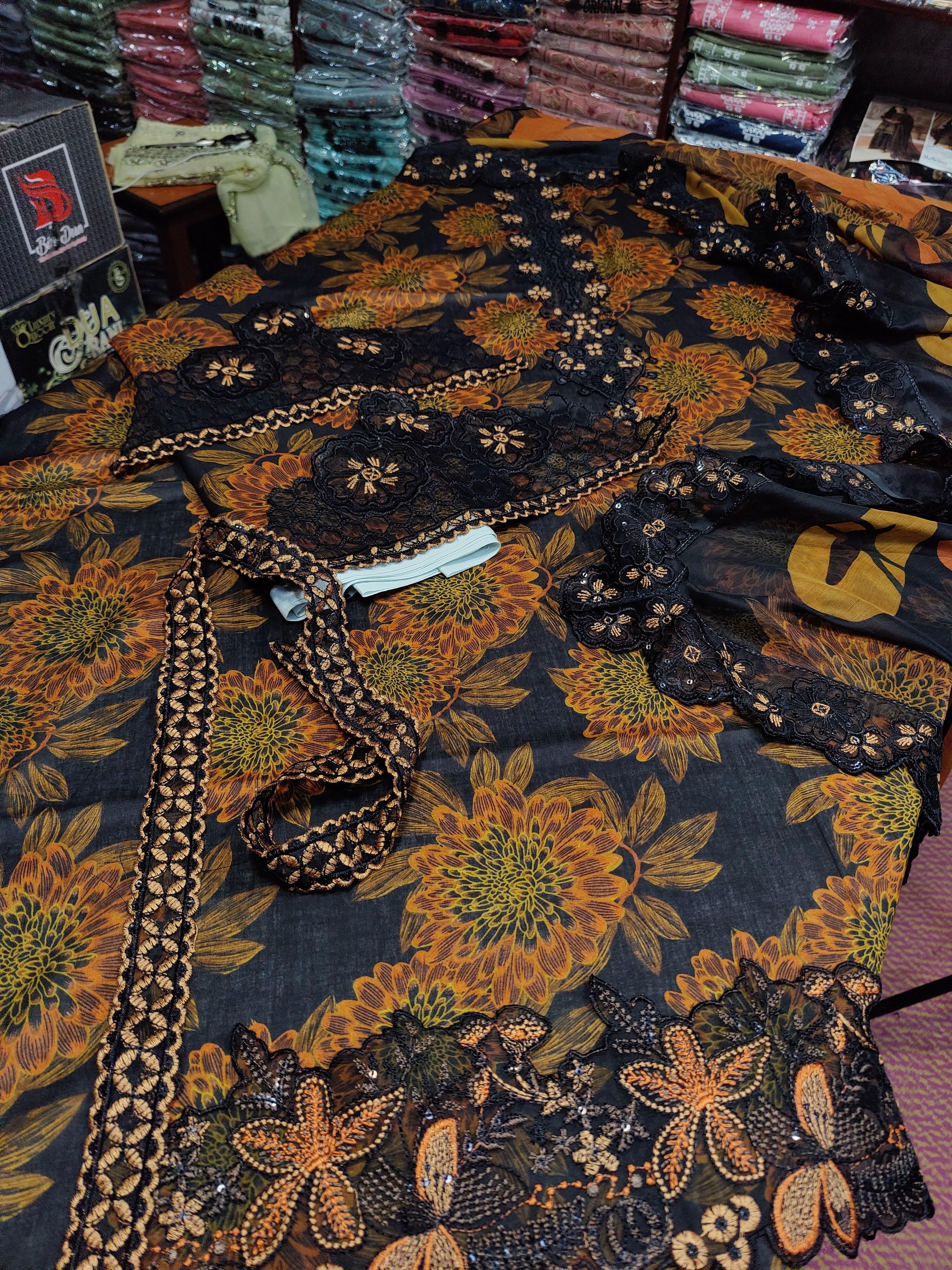 Colorful Ramsha sunflower textile by Danish Cloth, featuring vibrant sunflower patterns and intricate fabric details.