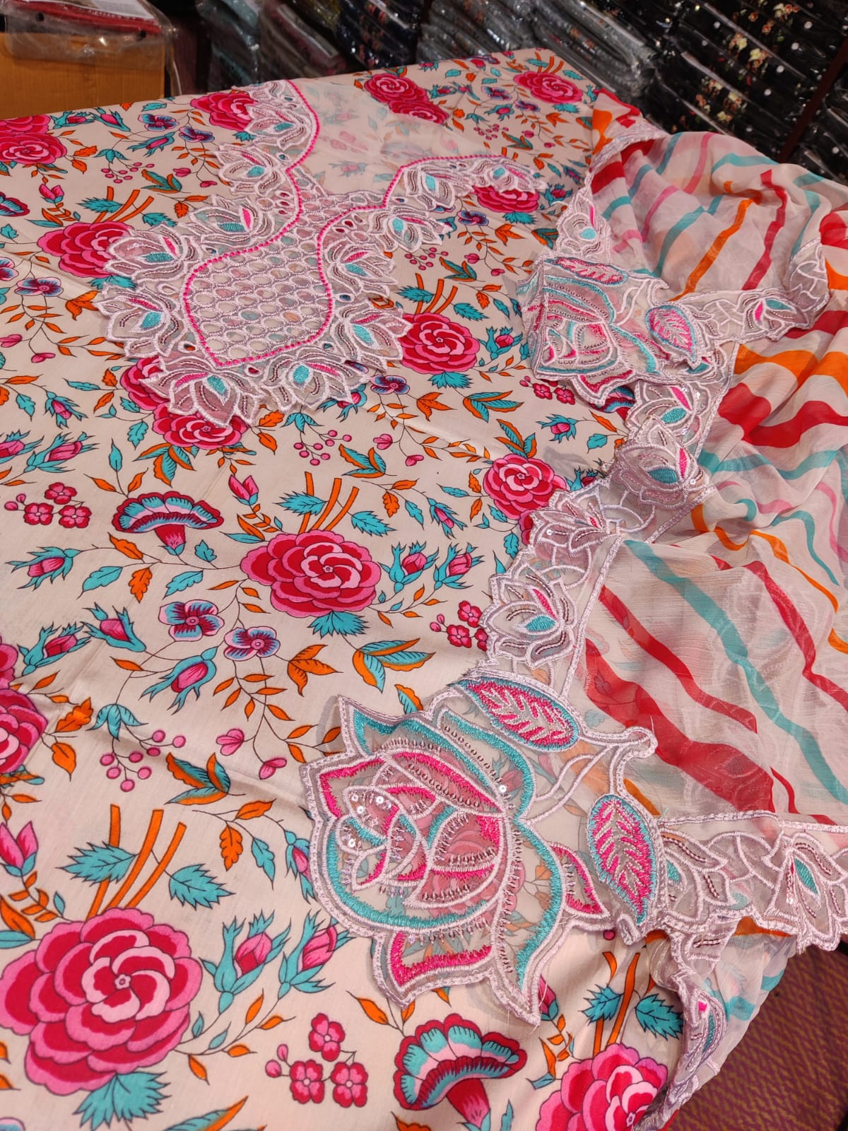 Danish Cloth Naba Aneela's colorful patterned fabric with intricate designs, showcasing vibrant textile craftsmanship.