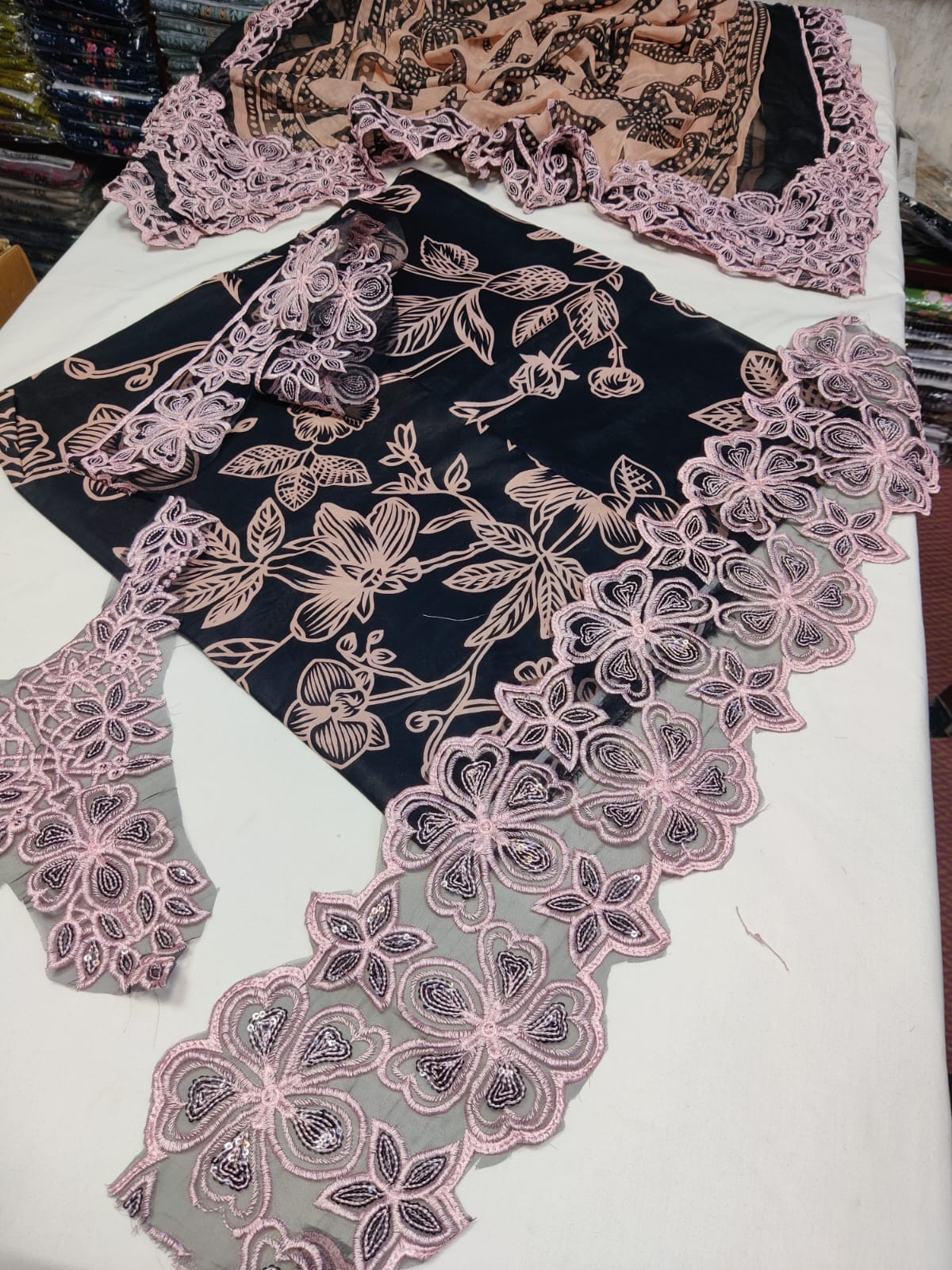 Danish Cloth Aneela's Black Pink fabric with black and pink pattern, showcasing soft, high-quality textile material.