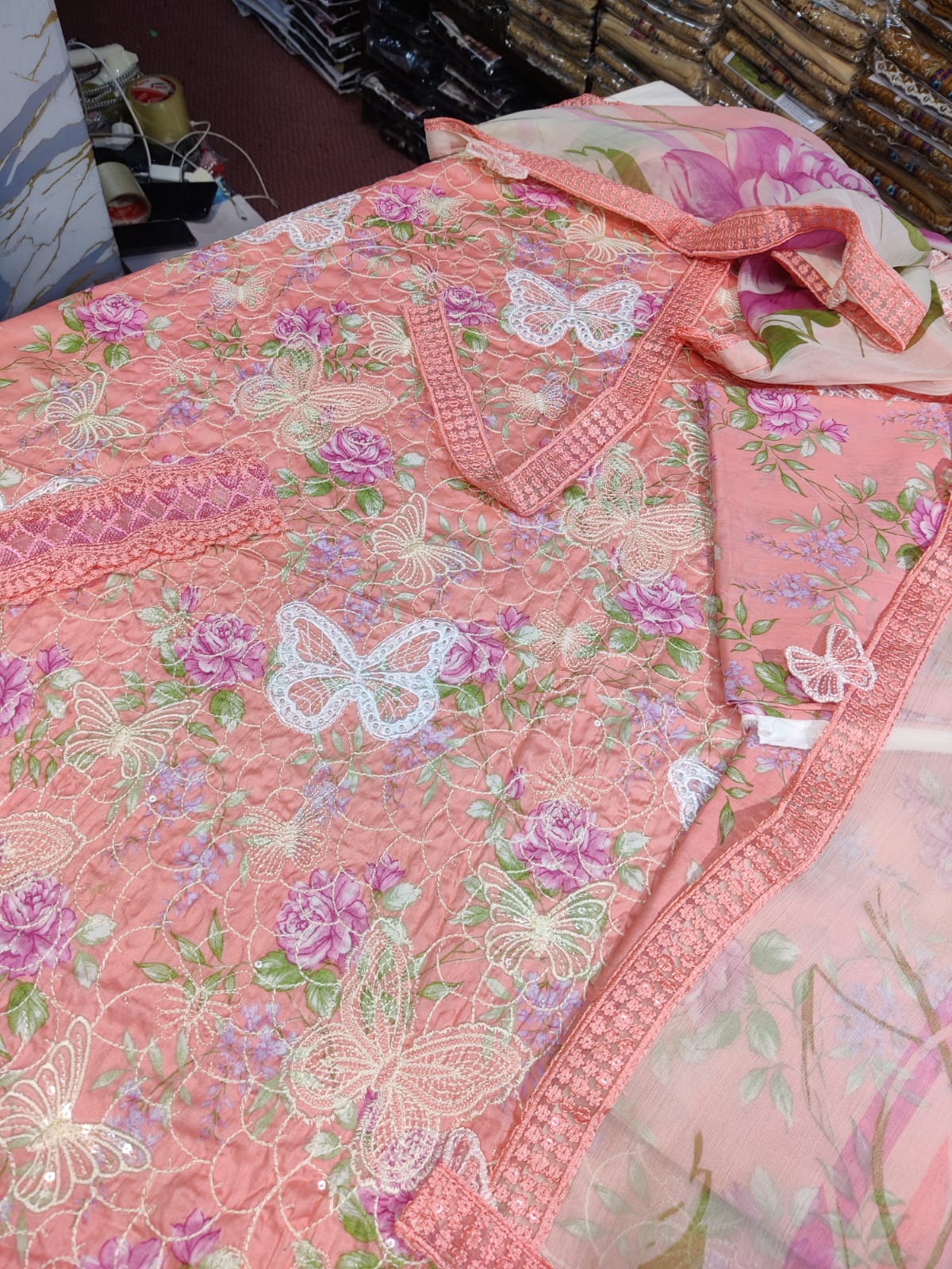 Pink butterfly-patterned dress by Danish Cloth, new Maria.b butterfly pink color, showcasing vibrant fabric and detailed design.